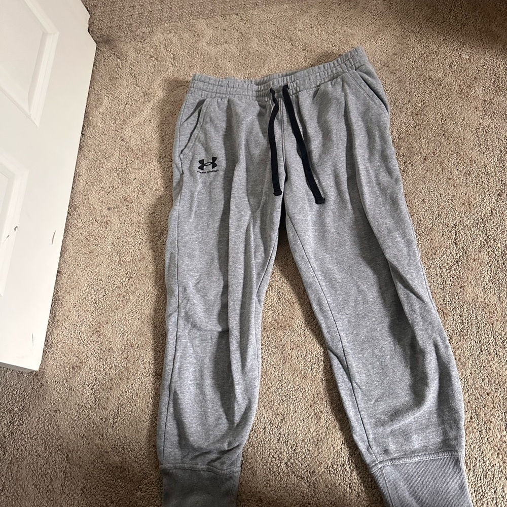 Under Armour women’s dark grey sweatpants with black strings. Size large.